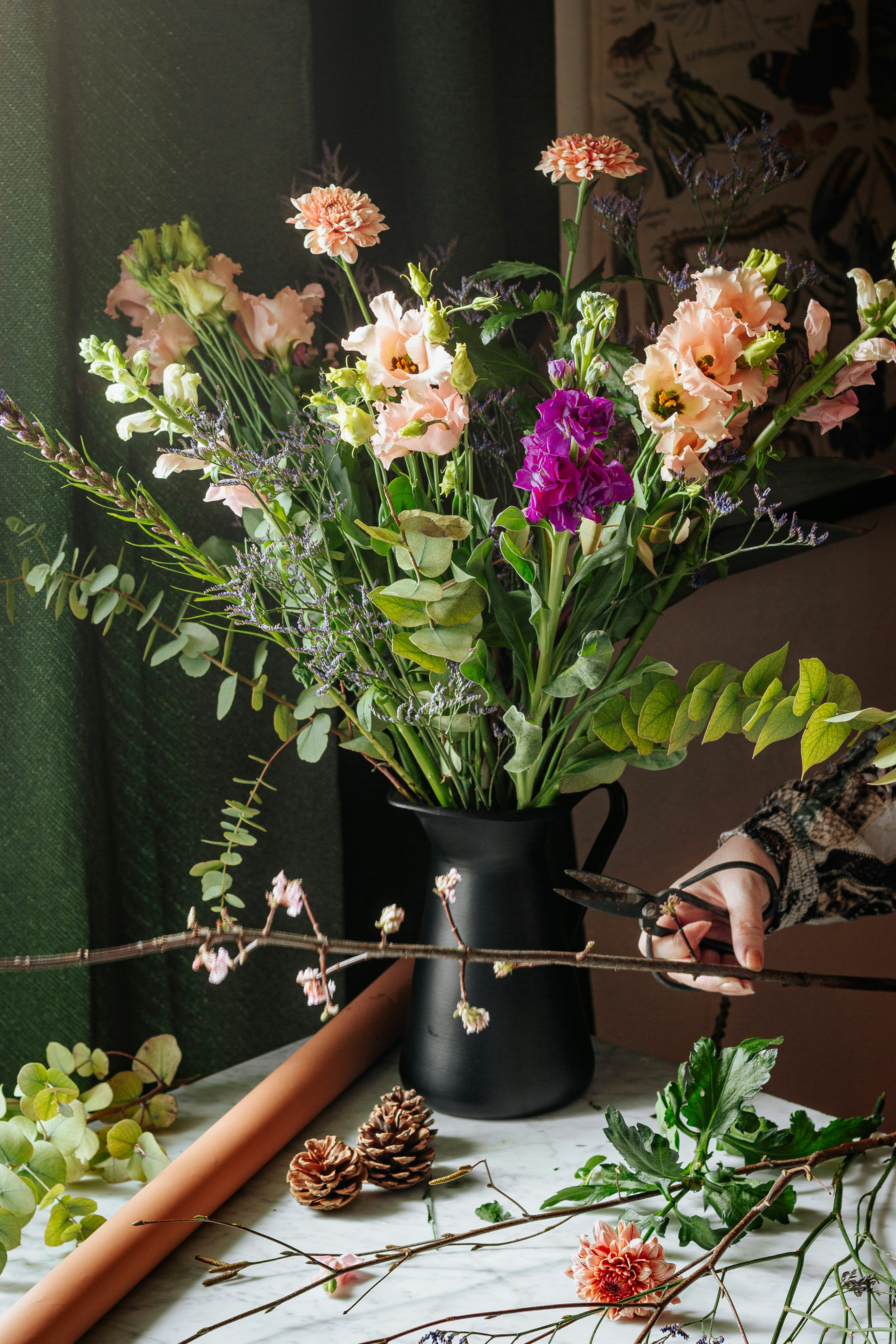 Person making a Bouquette of flowers